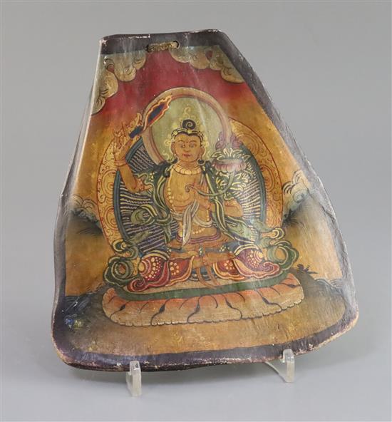 A Tibetan thangka depicting Bodhisattva painted on an ox shoulder bone, late 19th century, H. 20.5cm